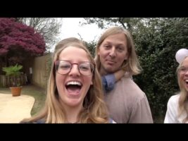 Family Plays Balloon Dart Game for Gender Reveal – 1027595